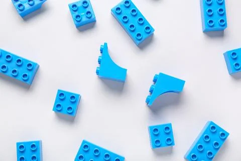 Blue plastic building blocks on grey background Stock Photos