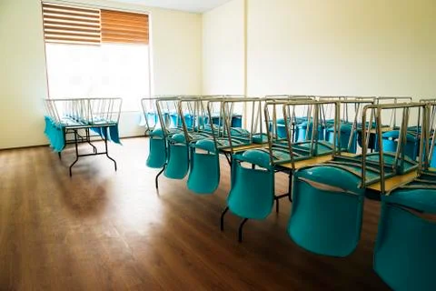 Blue plastic chairs are on the table Stock Photos