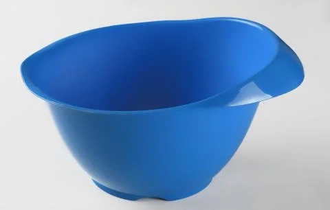 Blue plastic container for stirring cake isolated on whte background Photos