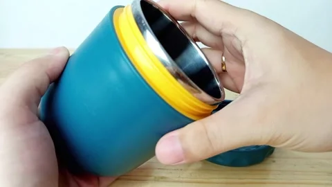 Blue Plastic Container on Wooden Table Surface Stock Footage 287848974