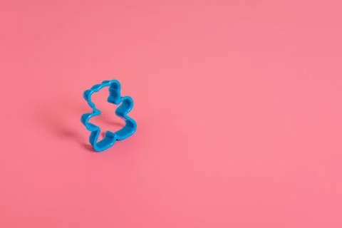 Blue plastic cookie cutter for making cookies in the shape of a teddy bear on Stock-Fotos