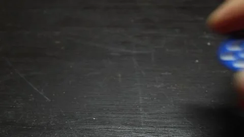 Blue plastic die rolls on a wooden table Stock Footage 157517886