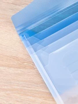 Blue  Plastic Document Folder on wooden table Stock Photos