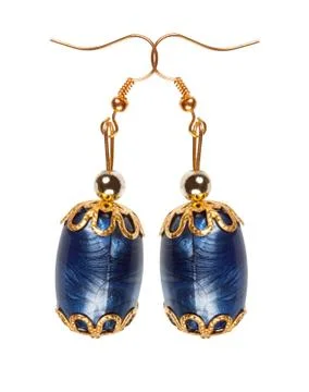 Blue plastic earrings with gold elements on a white background Stock Photos