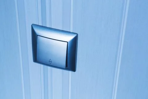 Blue plastic electric light switch Stock Photos