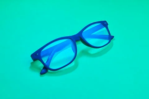 Blue plastic eyeglasses Stock Photos