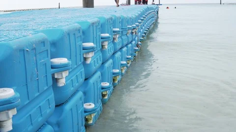 Blue plastic floating path in the beac Video stock 103253373