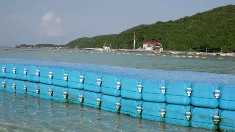 Blue plastic floating path in the beach Stock Footage 103253398