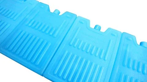 Blue plastic ice pack coolers arranged in a row isolated on a white backgroun Stock Photos