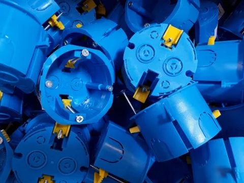 Blue plastic installation boxes for electrical outlets Stock Photos