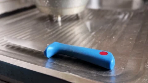Blue Plastic Kitchen Knife Handle Resting on Stainless Steel Sink Drainboard Stockbeeldmateriaal 331555357