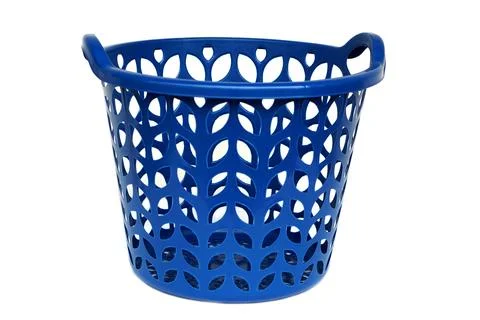 Blue plastic laundry basket with leaf-shaped cutout design isolated on white bac Stock Photos