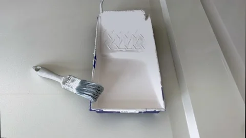 Blue plastic paint tray with white paint and brush roller.  Paint roller Stock Footage 156568719