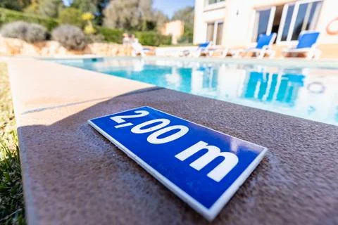 Blue plastic plate indicating a depth of 2.00 meters Stock Photos