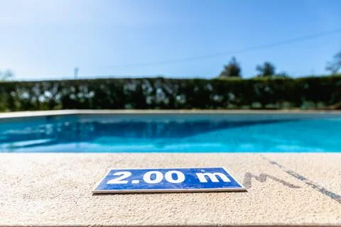 Blue plastic plate indicating a depth of 2.00 meters Stock Photos