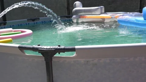 Blue plastic pool in the garden. 動画素材 163262783