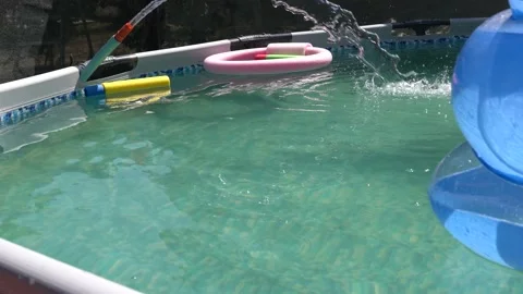 Blue plastic pool in the garden. Stock Footage 166018369