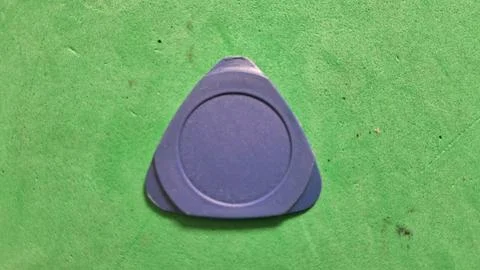 Blue plastic prying tool for opening small electronic mobile devices Stock Photos