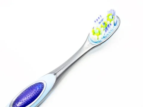 Blue plastic toothbrush on a white background. Foto stock