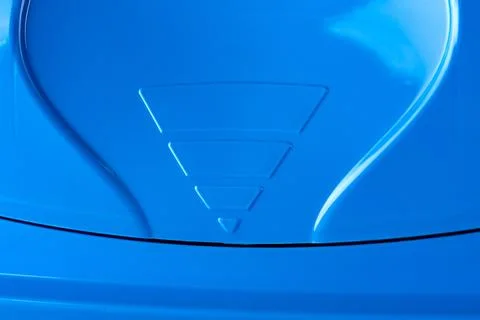 A blue plastic trash bin close up Stock Photos