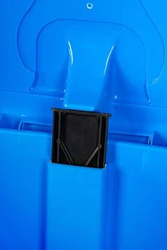 A blue plastic trash bin close up Stock Photos