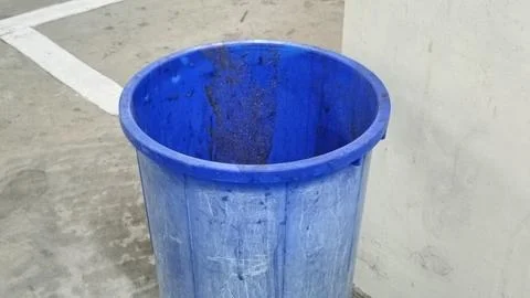 Blue Plastic Trash Bin in Empty Parking Garage Stock Photos