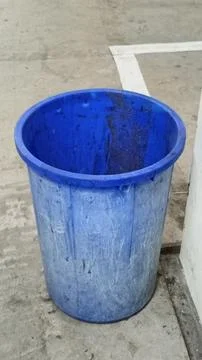 Blue Plastic Trash Bin in Empty Parking Garage Stock Photos