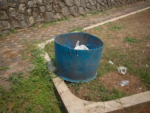 Blue plastic trash can Stock Photos