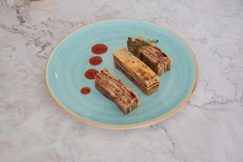 A blue plate with three different types of food on it Stock Photos