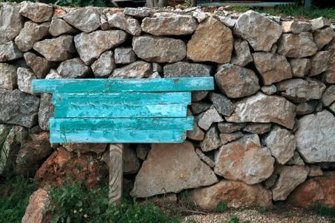 Blue pointer over a background of stones Stock Photos