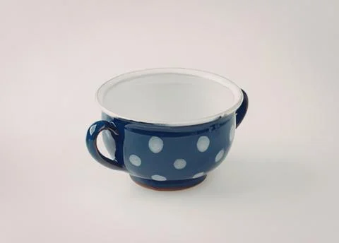 Blue polka dot ceramic coffee cup with handle Photos