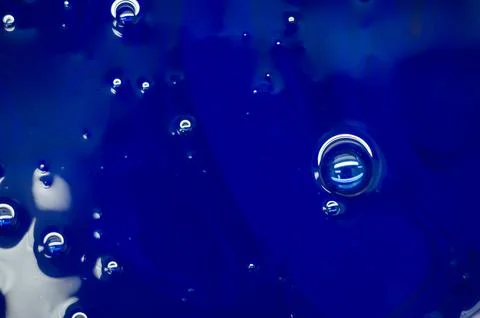 Blue polygraph offset paint for the printing press. Special UV ink for printing Stock Photos