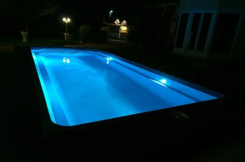 Blue pool at night. Stock Photos