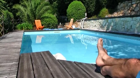 Blue Pool with person's legs in forefront Stock Footage 52751328