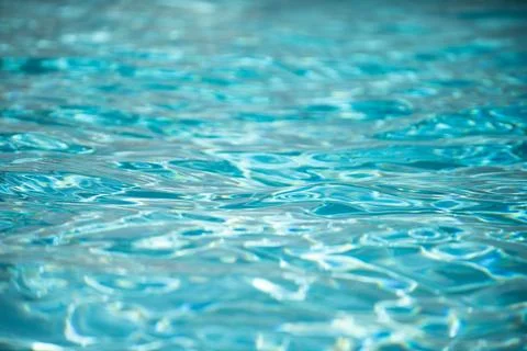 Blue pool water background. Blurred transparent clear calm water surface texture Stock Photos
