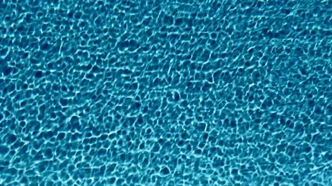 Blue pool water rippled by wind Stock Footage 274306209