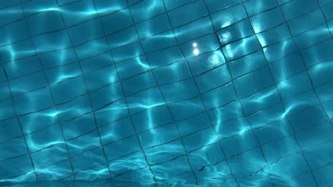 Blue pool water with sun reflections.Abstract background of water. Stock Footage 134574562