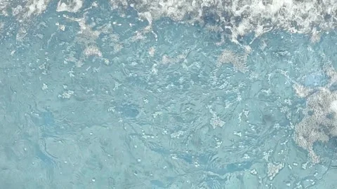 Blue pool water surface disturbed with rapid splashes Stock Footage 317399316