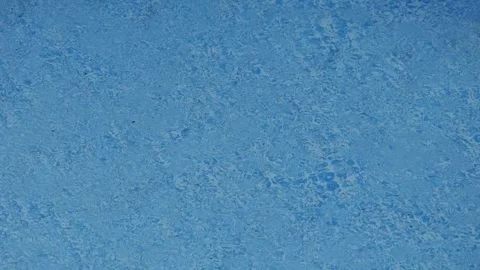 Blue pool water surface with ripples Vídeos de archivo 339470337