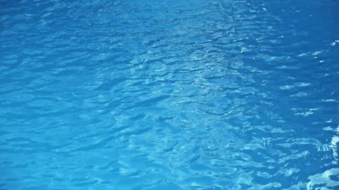 Blue Pool Water Surface with Sunlight Ripples, Close Up Stock Footage 348097771