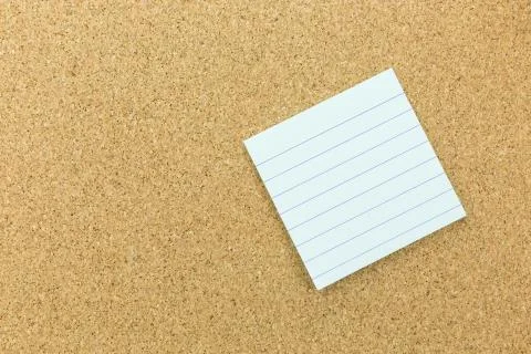 Blue post it with line on cork board Stock Photos