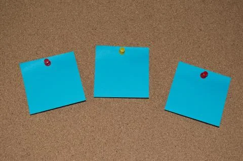 Blue Post it Notes on a Cork Board Stock Photos
