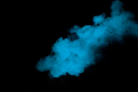 Blue powder explode cloud on black background. Stock Photos