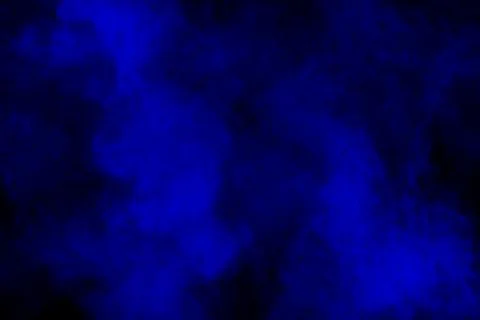 Blue powder explode cloud on black background.Launched blue dust particles. Stock Photos