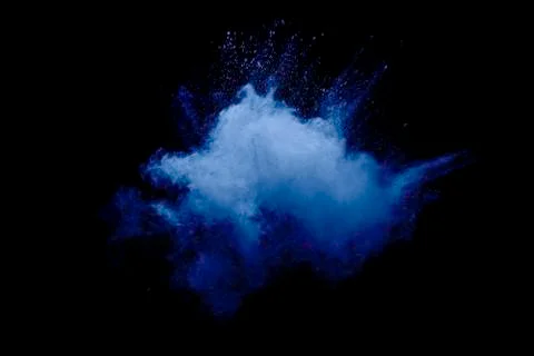 Blue powder explode cloud on black background.Launched blue dust particle. Stock Photos