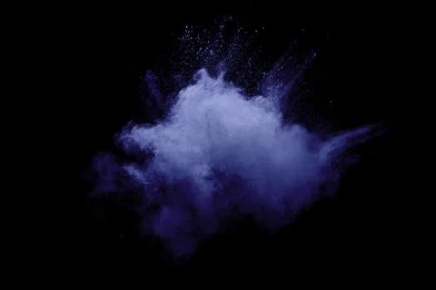 Blue powder explode cloud on black background.Launched blue dust particles .. Stock Photos