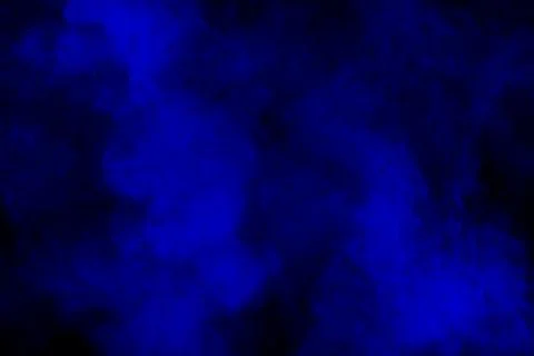 Blue powder explode cloud on black background.Launched blue dust particles .. Stock Photos