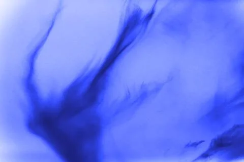 Blue powder explosion on black background. Colored cloud. Colorful dust exp.. Stock Photos
