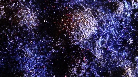Blue powder particles fly after being exploded in slow motion Stock Footage 86143698