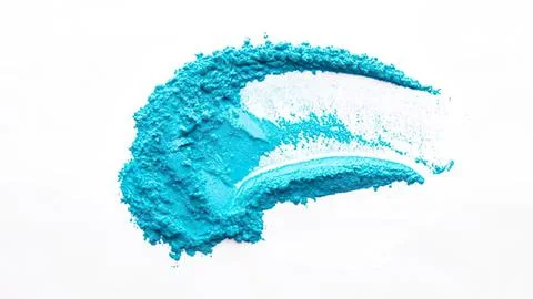 Blue powder spread in a curved shape on white background Stock Photos